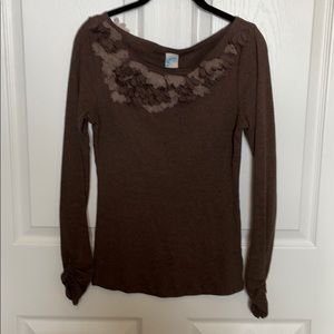Sweater with accented neckline and back shoulder